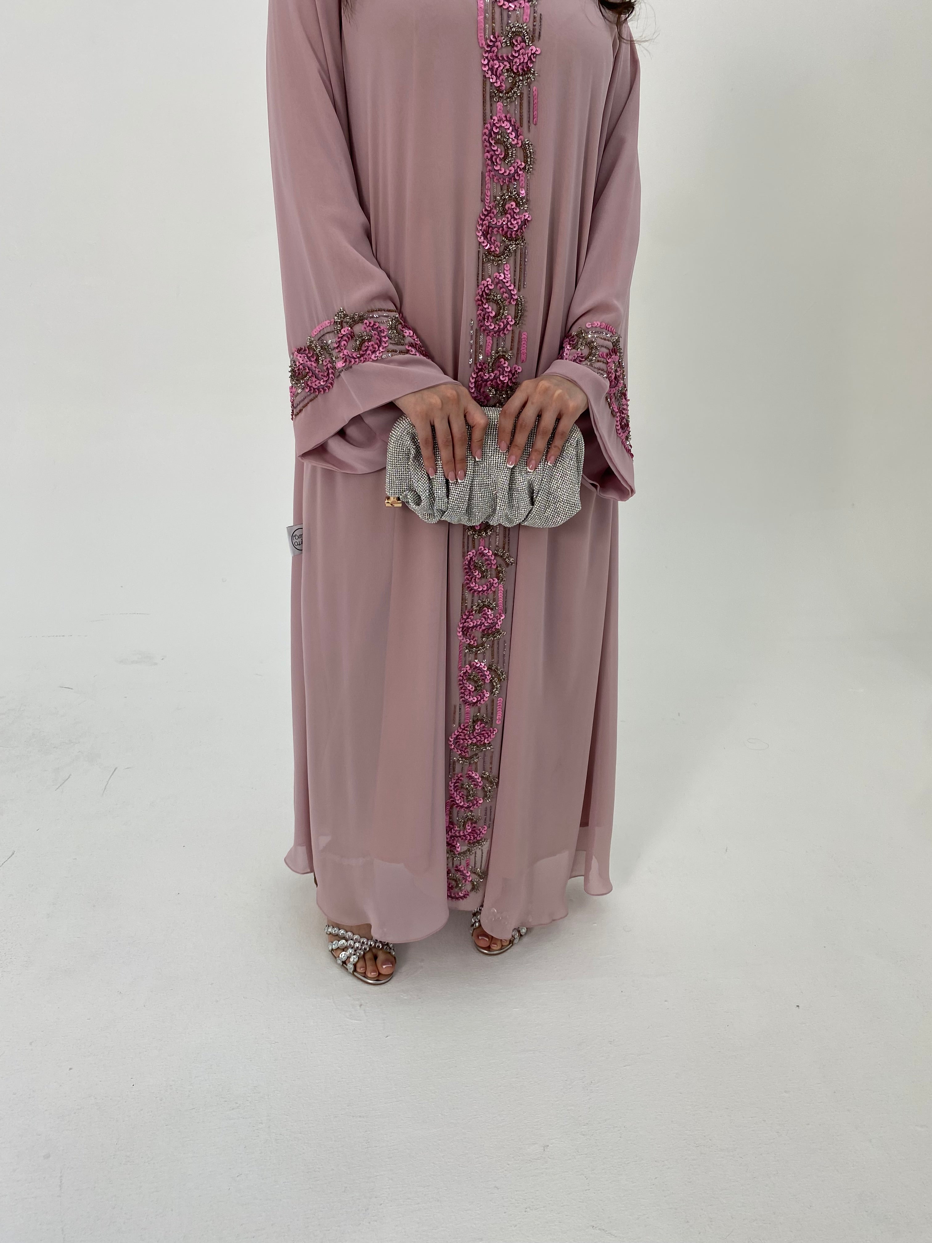 Mauve abaya with floral embroidery on a white background