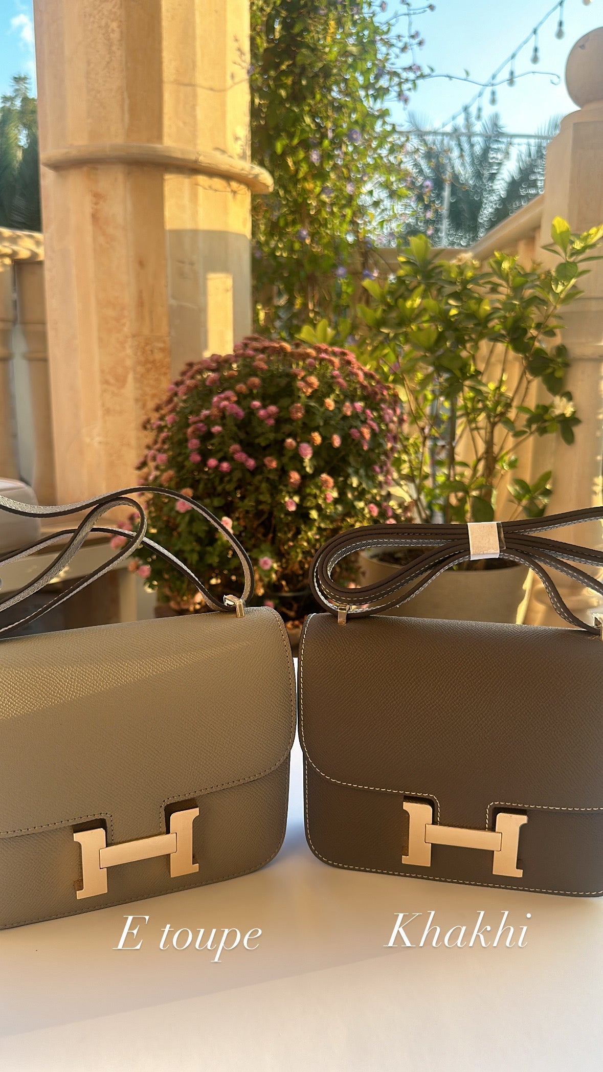 Two handbags, one green and one brown, with gold hardware on a surface outdoors.