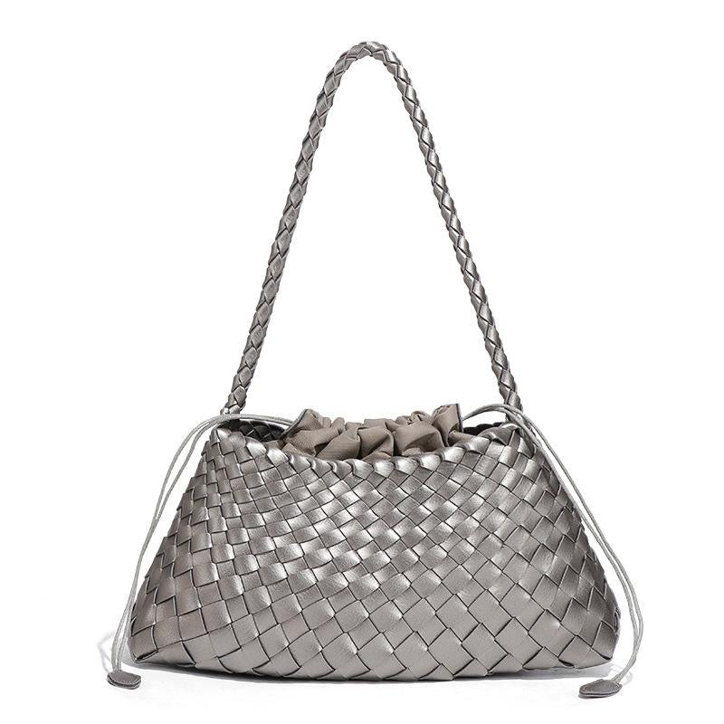 Silver woven handbag with braided handle on a white background
