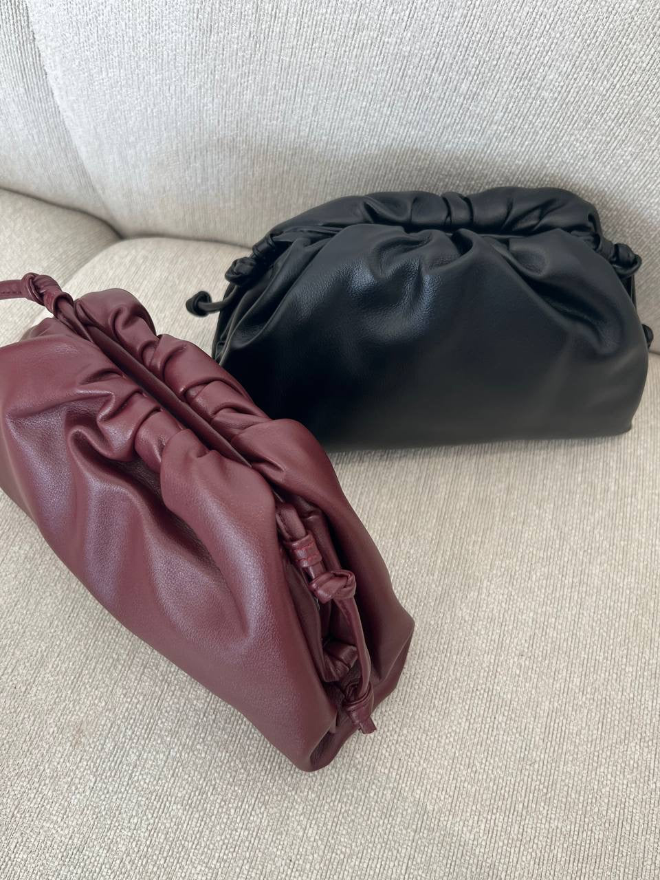 Clear UAE maroon Bottega pouch bag detail view
