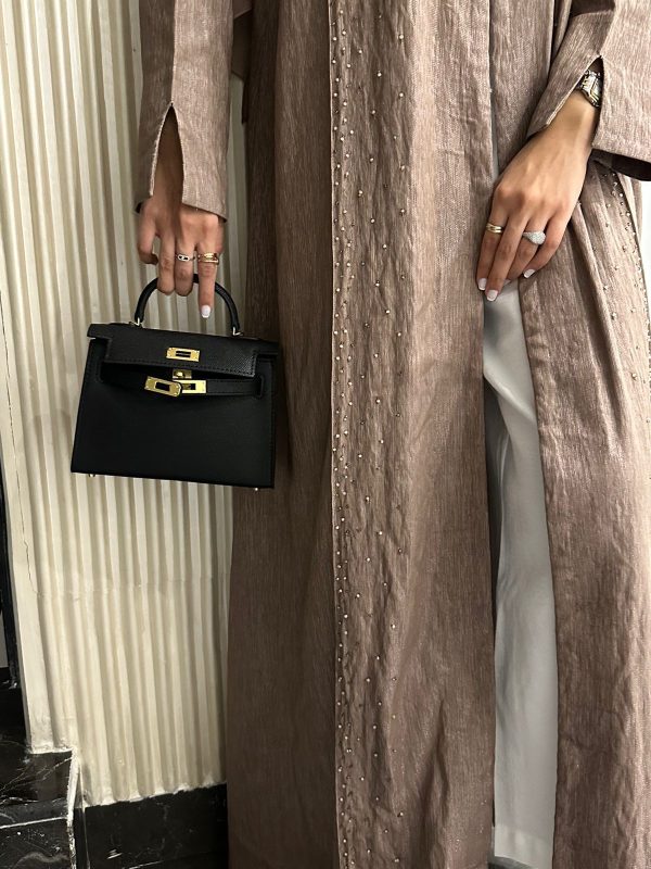 Clear UAE black Kelly structured bag front view
