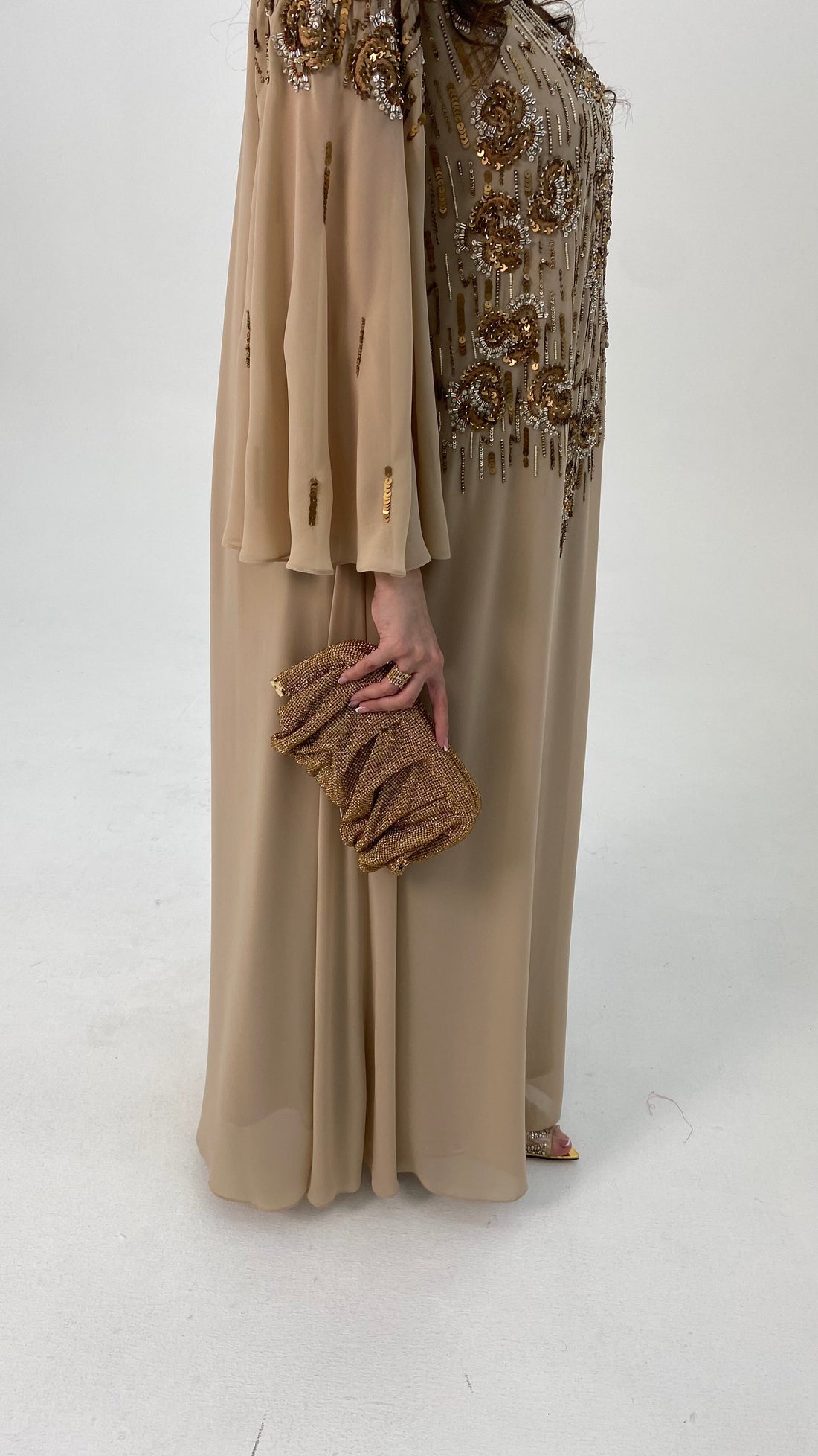 Beige outfit with gold embroidery and matching scarf on a white background