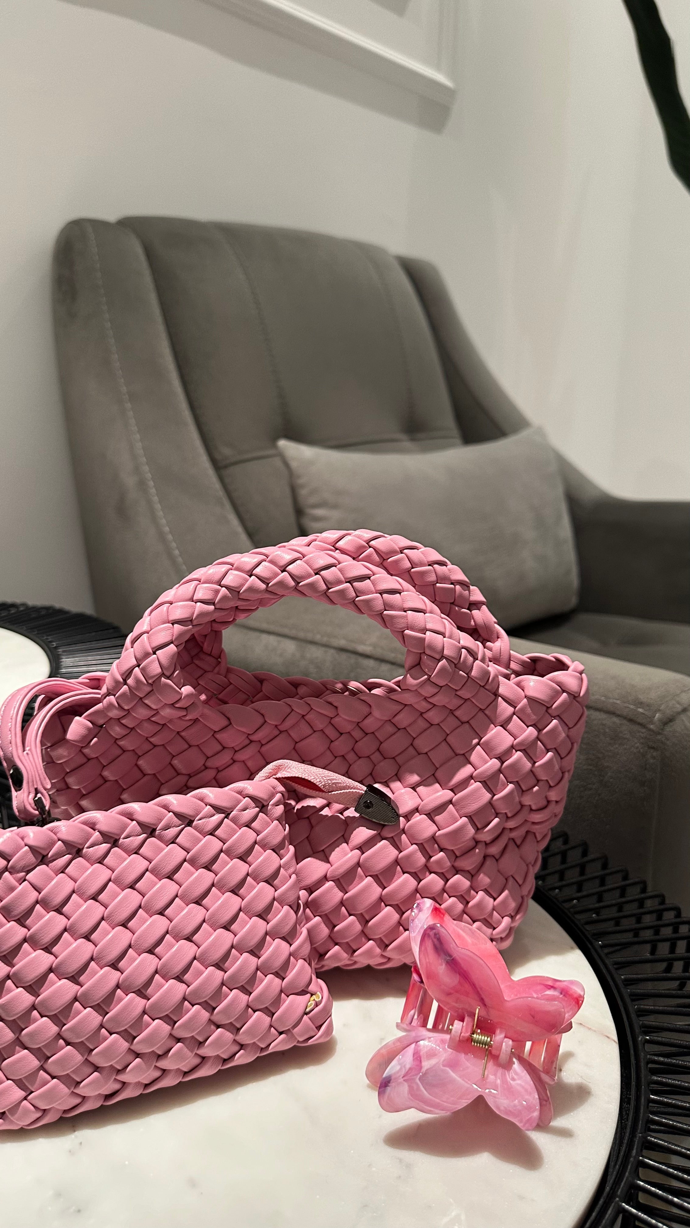Clear UAE pink woven shoulder bag detail view
