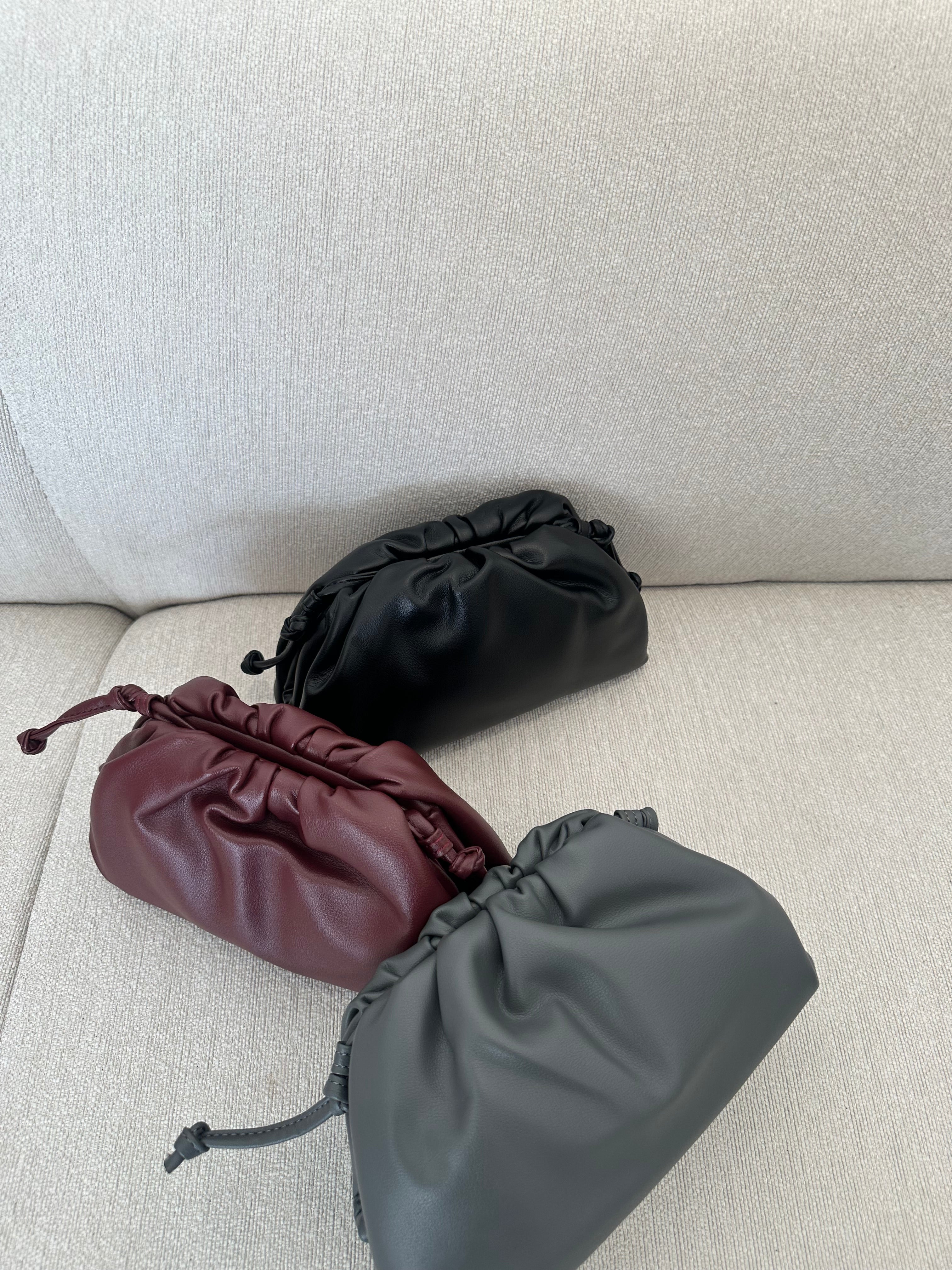 Clear UAE maroon Bottega pouch bag detail view
