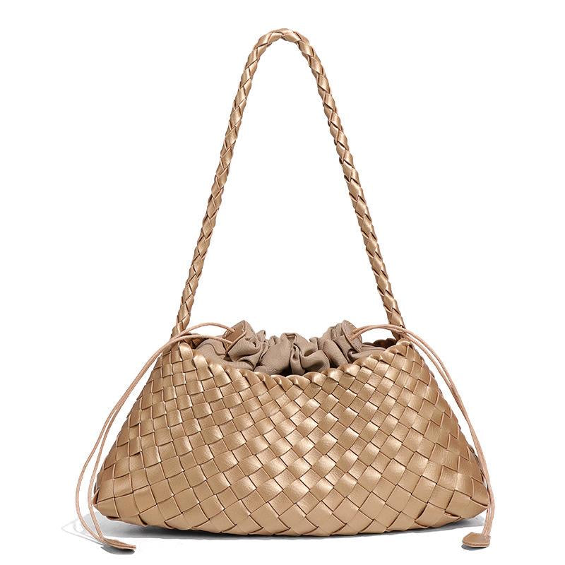 Beige woven handbag with braided handle on a white background