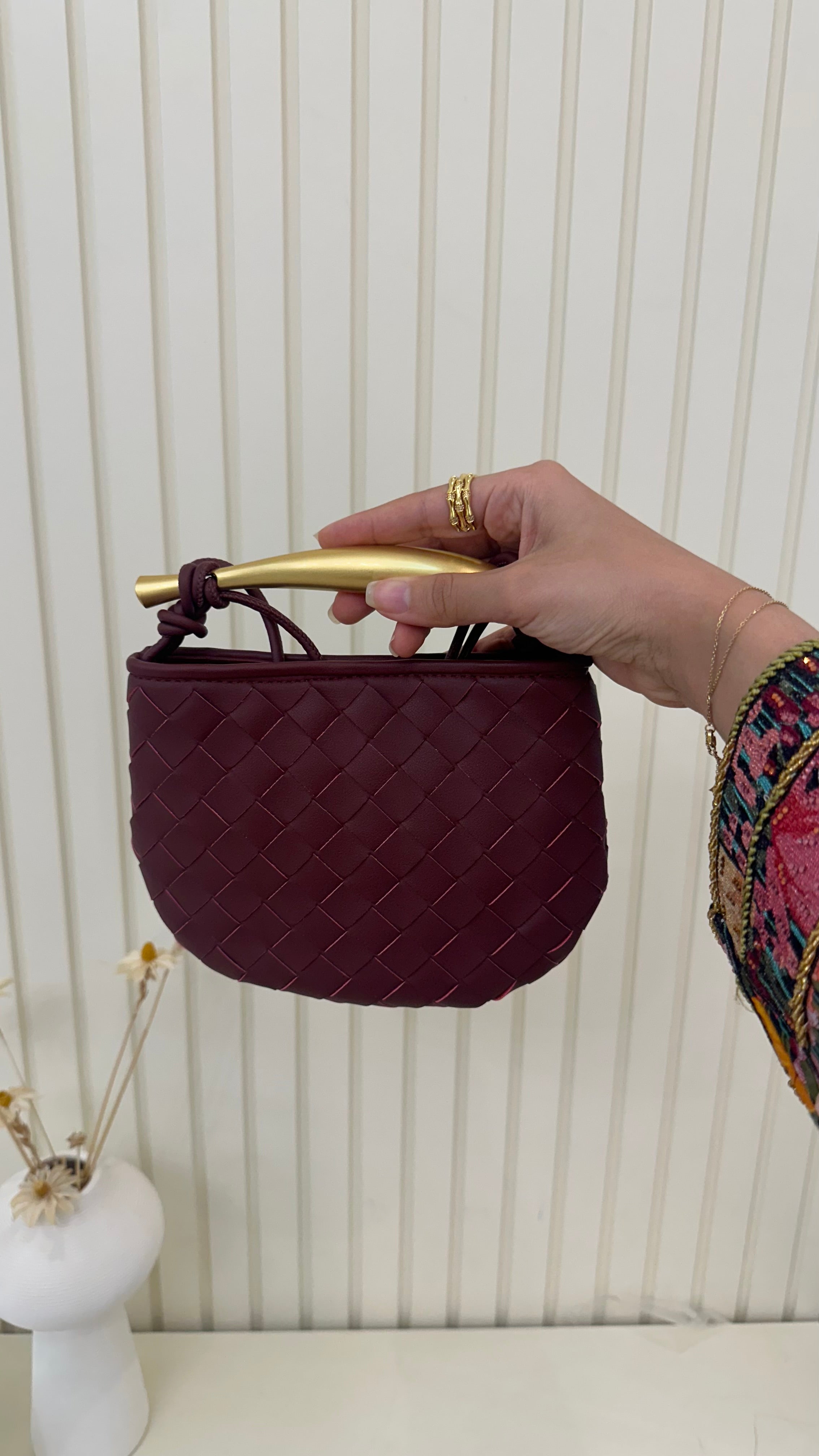 Clear UAE maroon sardine mini bag lifestyle shot
