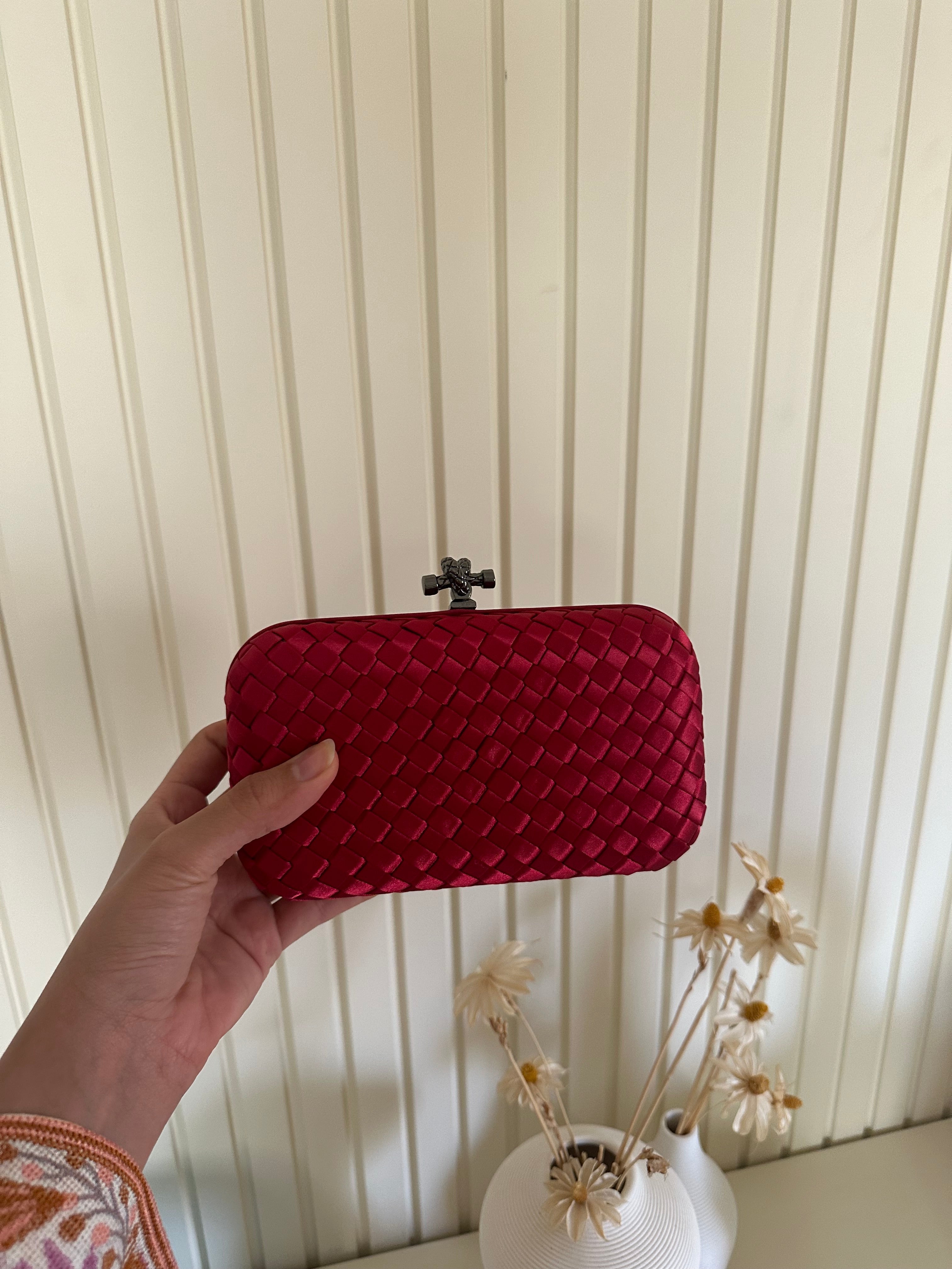 Clear UAE red mini clutch bag front view
