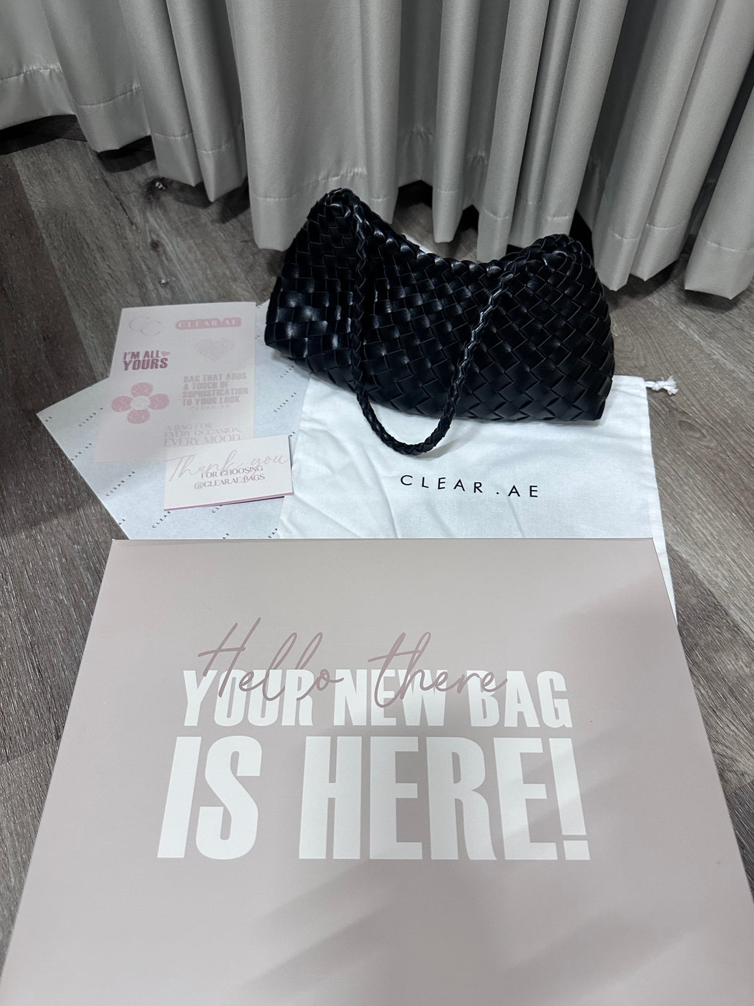 Black handbag on a white surface with 'CLEARANCE' label and text 'Your choice is here!'