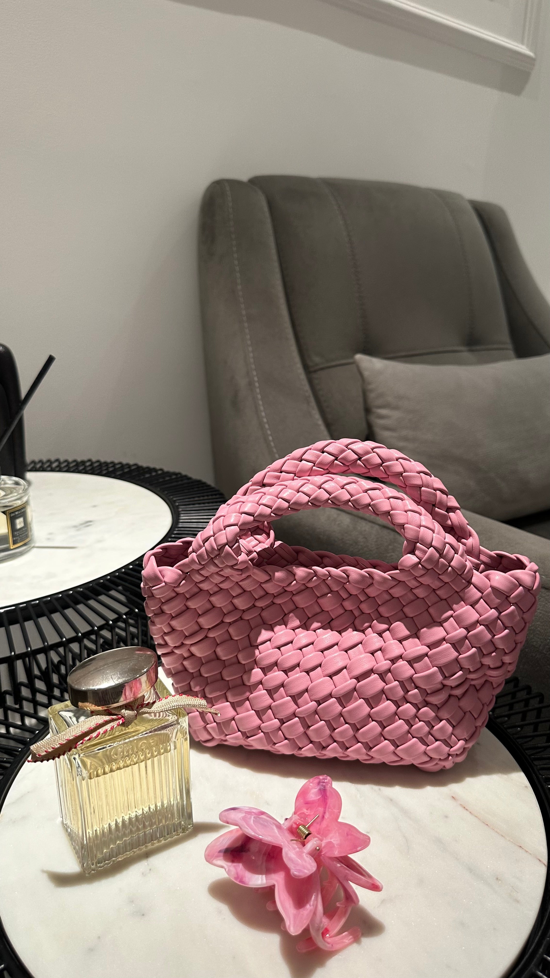 Clear UAE pink woven shoulder bag detail view

