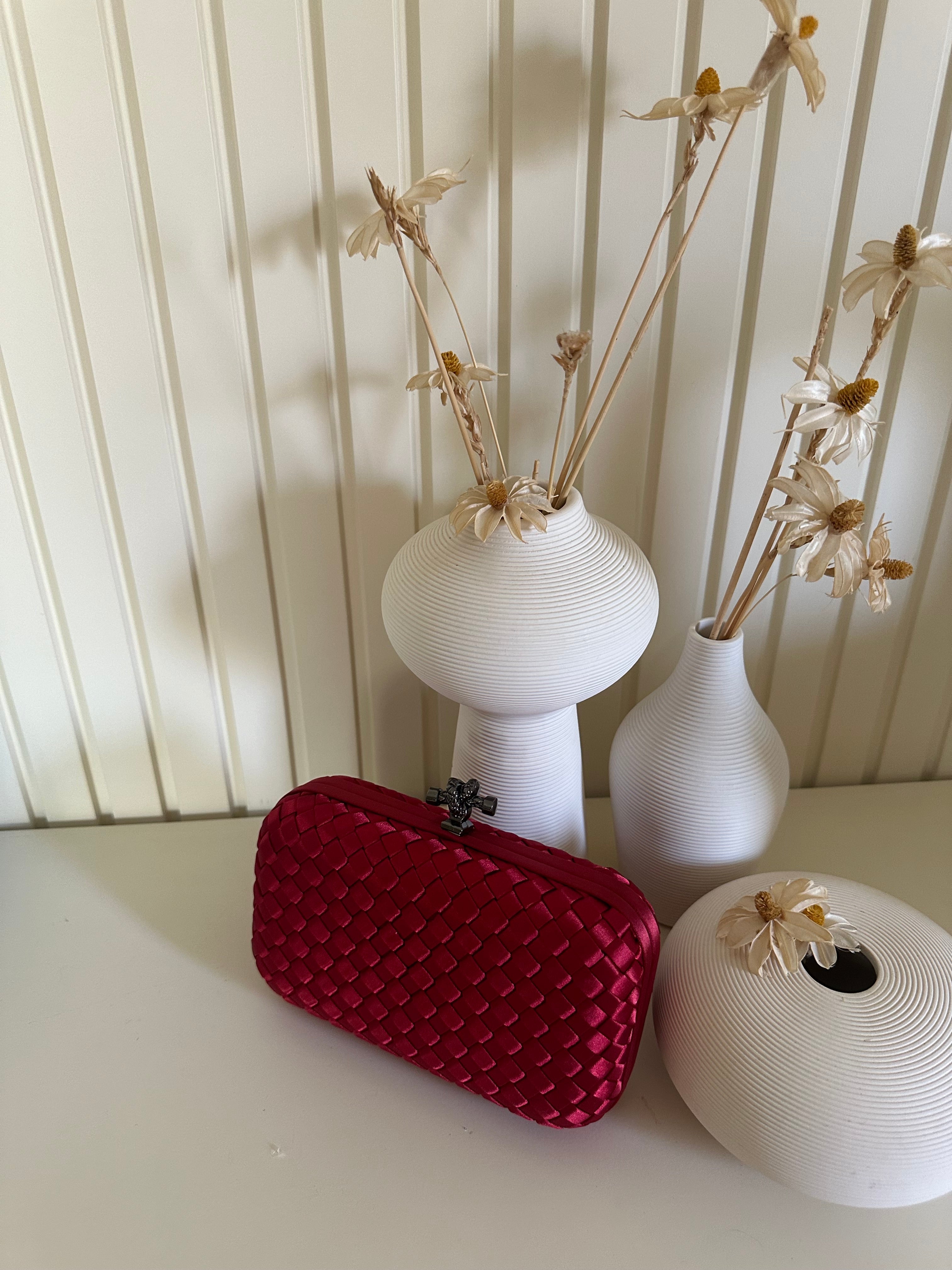 Clear UAE red mini clutch bag front view
