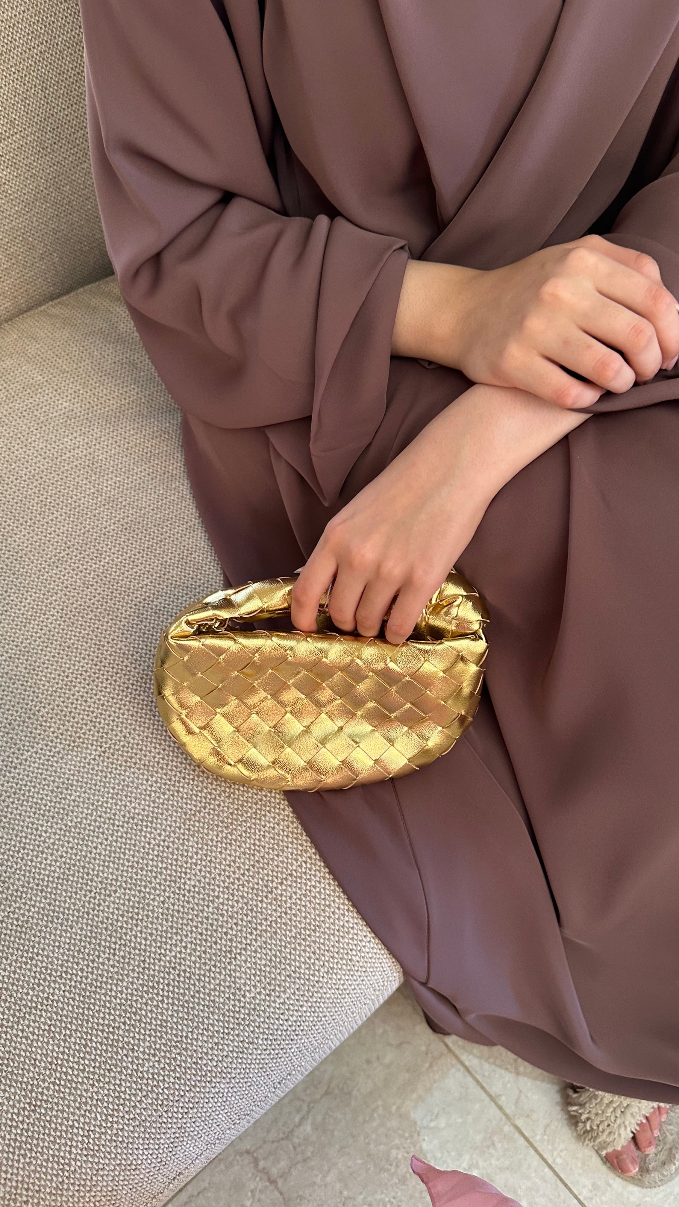 Gold micro handle bag by Clear UAE