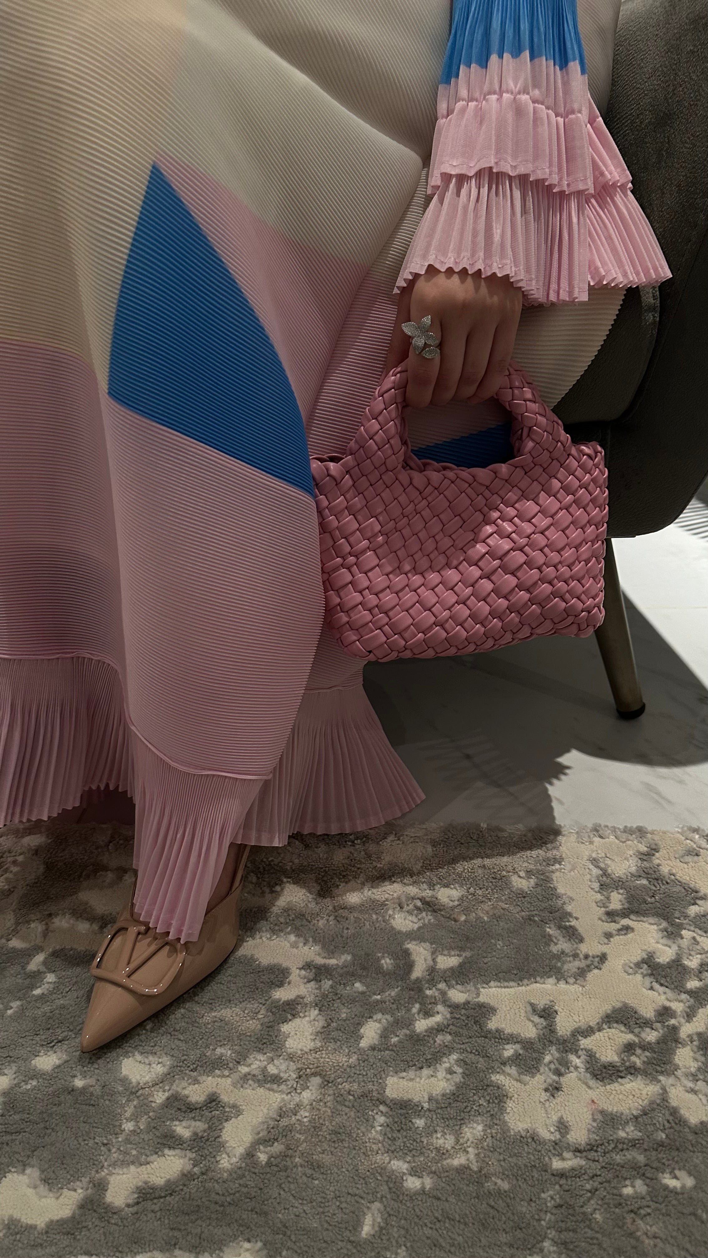 Clear UAE pink woven shoulder bag detail view
