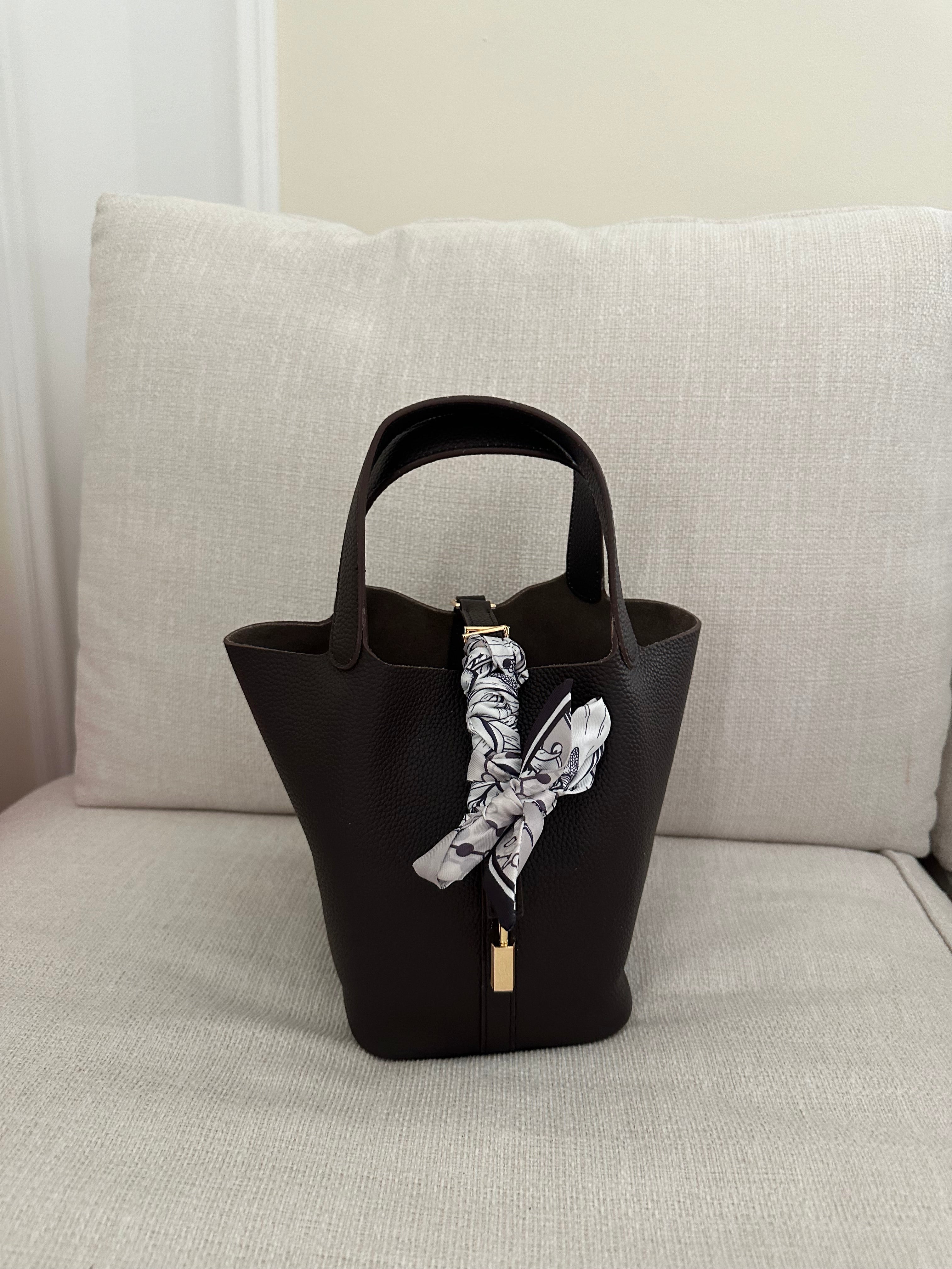Clear UAE burgundy P bag front view
