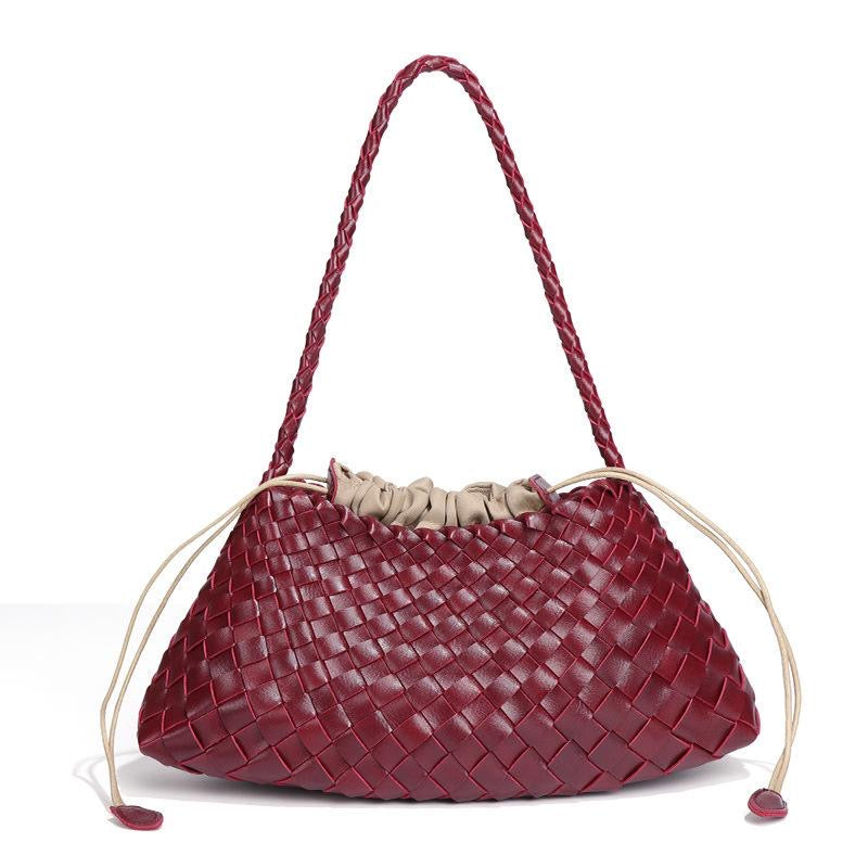Red woven handbag with a beige drawstring on a white background