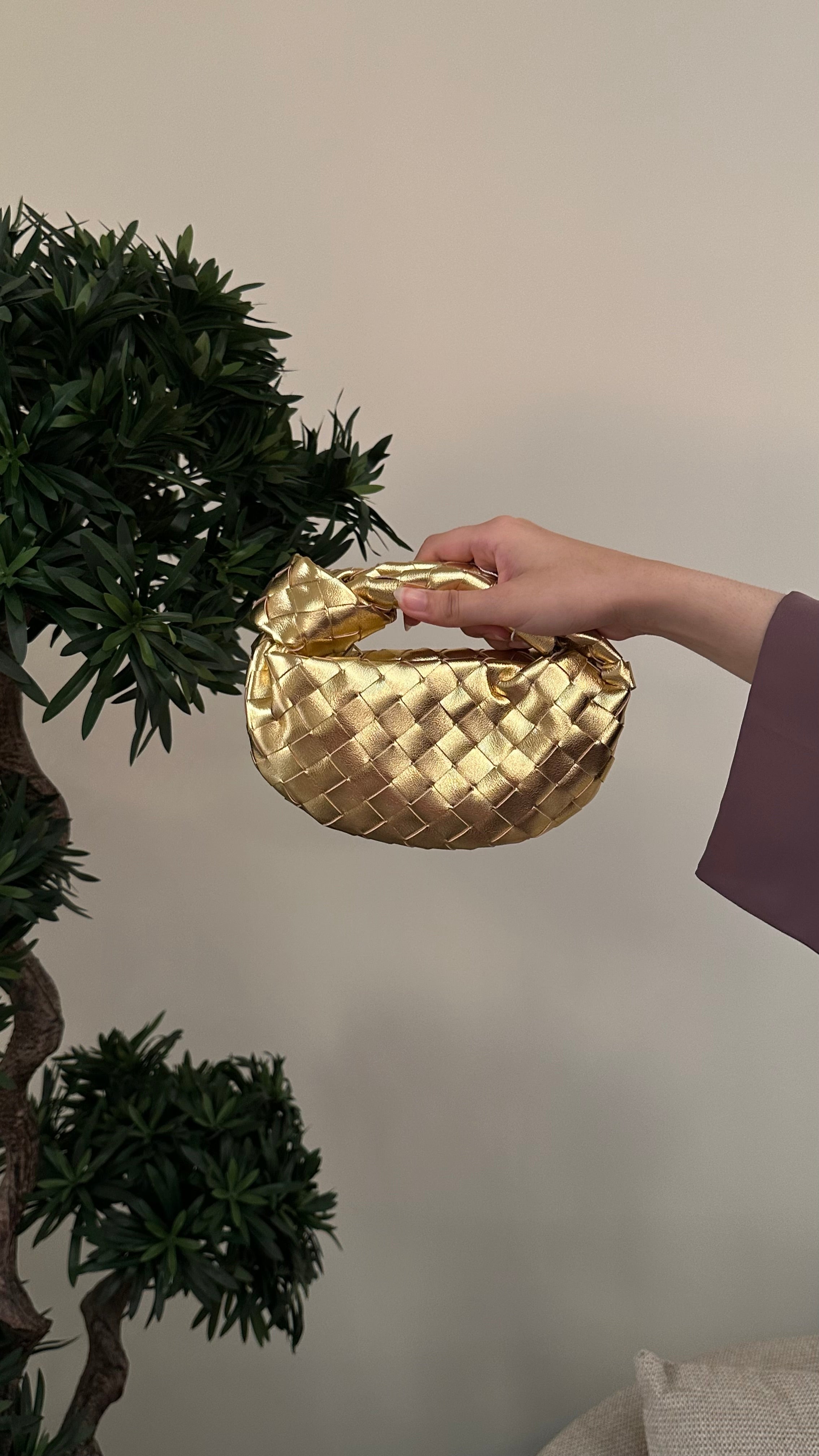 Gold micro handle bag by Clear UAE