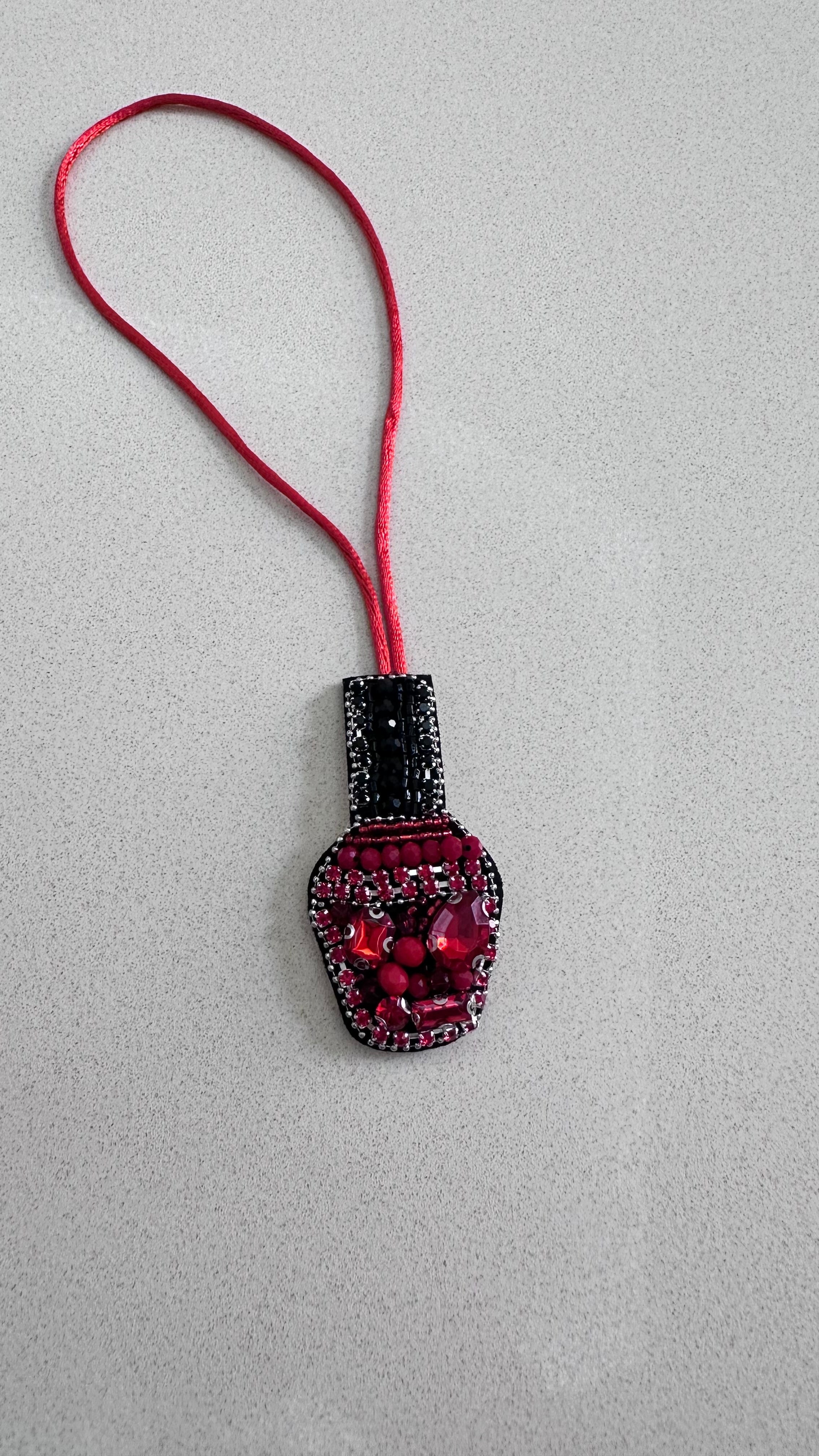 Nail polish charm