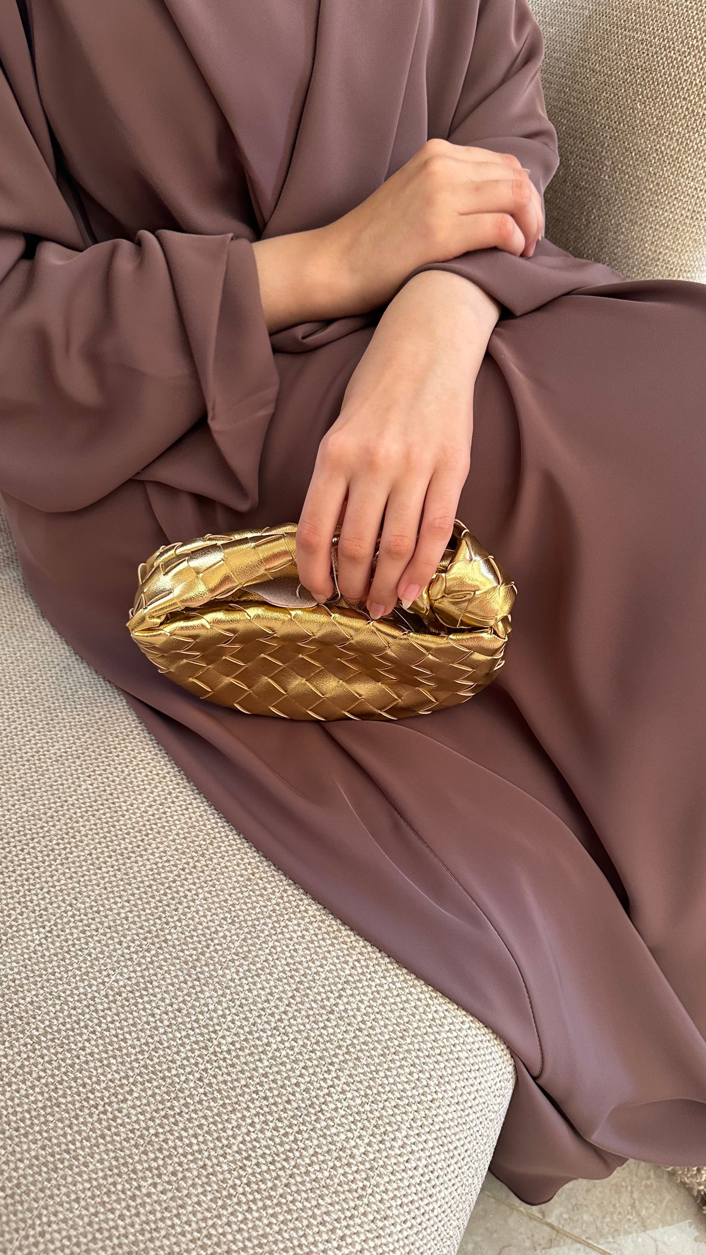 Gold micro handle bag by Clear UAE