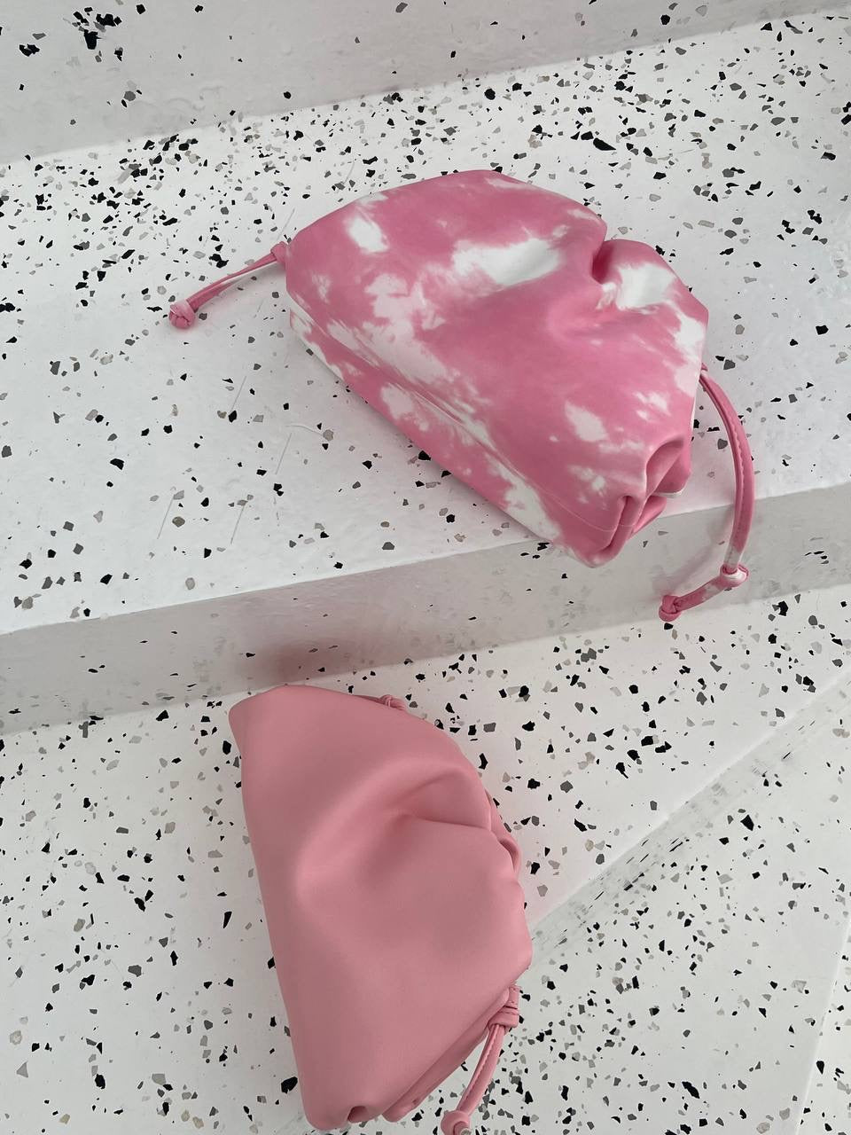 Clear UAE mix pink Bottega pouch bag detail view
