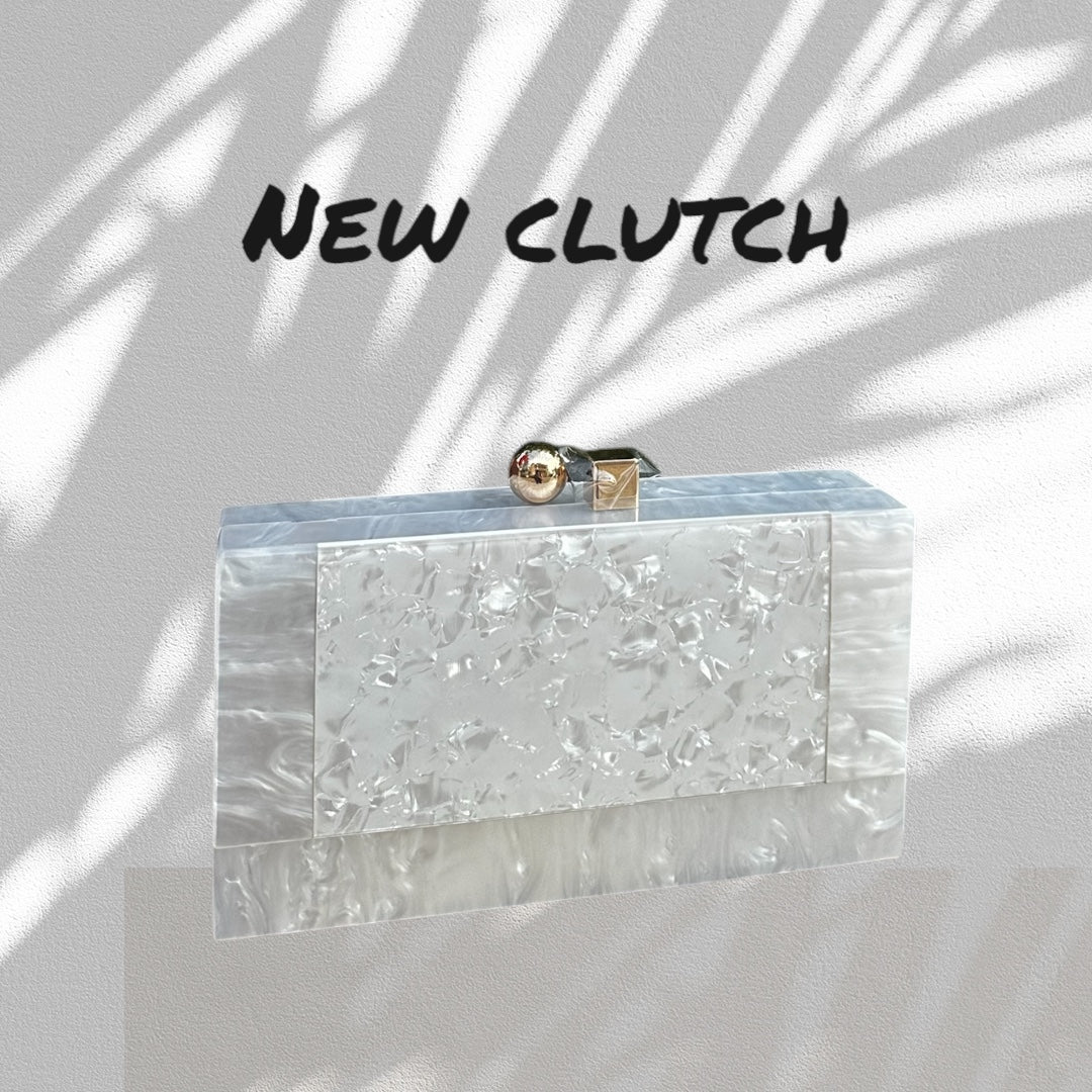 Clear clutch with marble texture on a light background