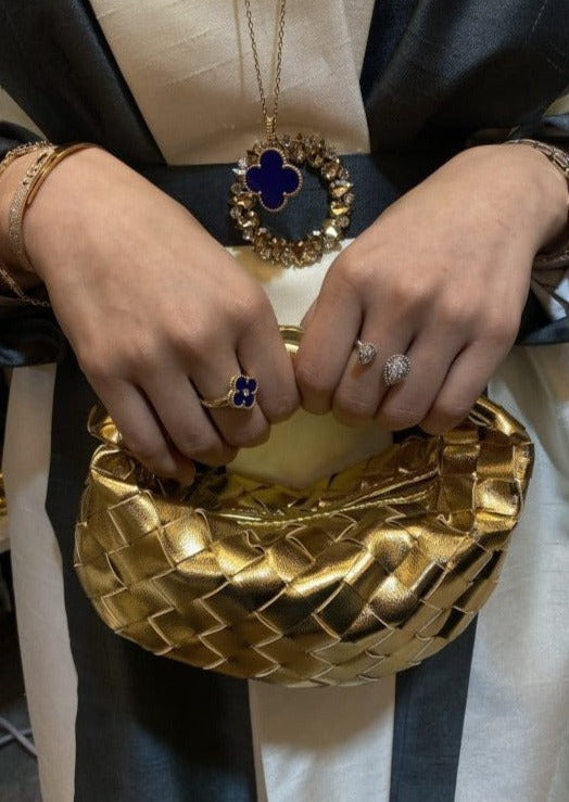 Gold micro handle bag by Clear UAE