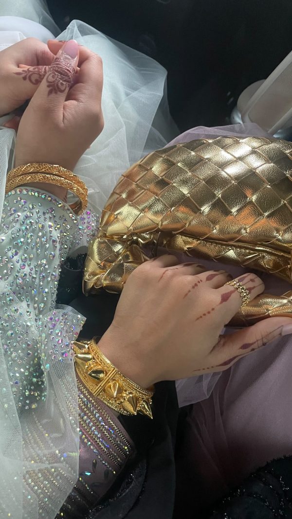 Gold micro handle bag by Clear UAE