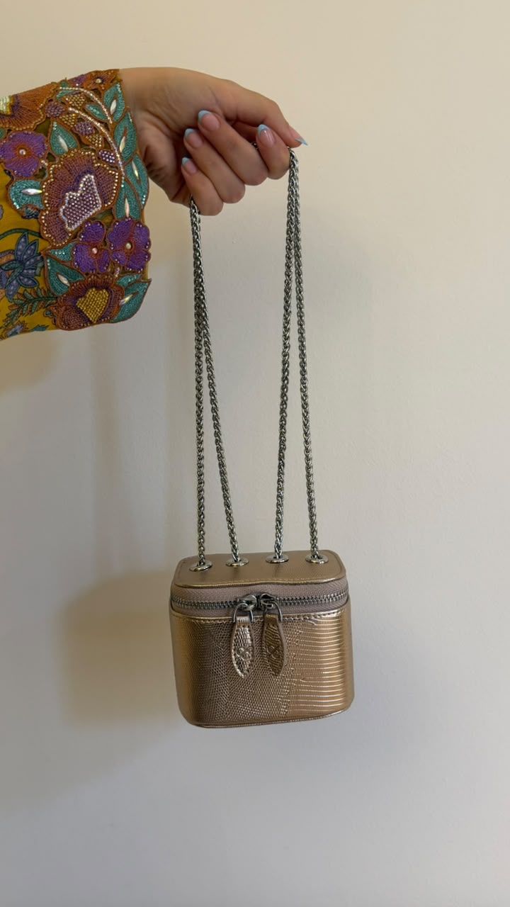 Mini Vanity Chain Bag Gold - flat lay on sofa