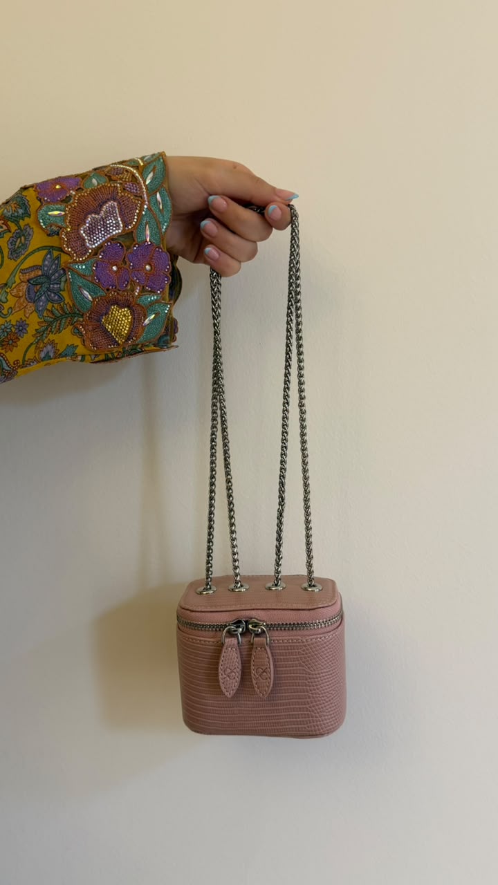 Mini Vanity Chain Bag Gold - side view held with chain strap