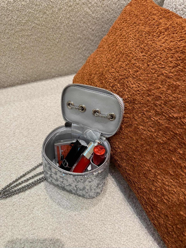 Silver sequin vanity mini bag on shelf next to incense burner