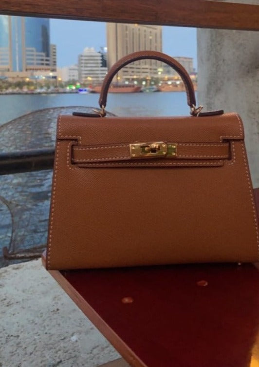 Brown Hermès Kelly-inspired structured bag front view by Clear UAE
