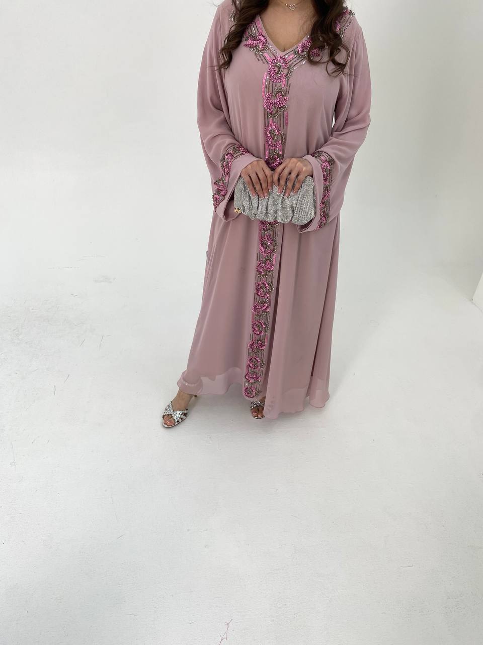 Pink dress with floral patterns on a white background